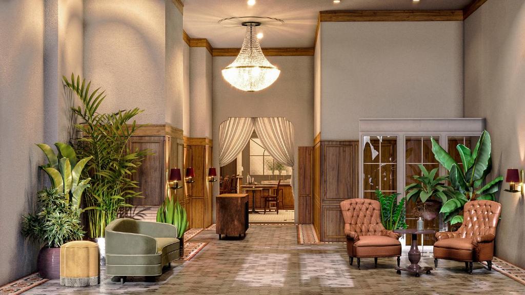 诺克斯维尔Hotel Cleo Knoxville的大堂设有桌椅和吊灯。