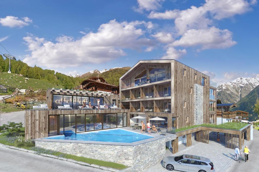 索尔登索登格伦瓦尔德度假酒店的一座建筑前面设有游泳池