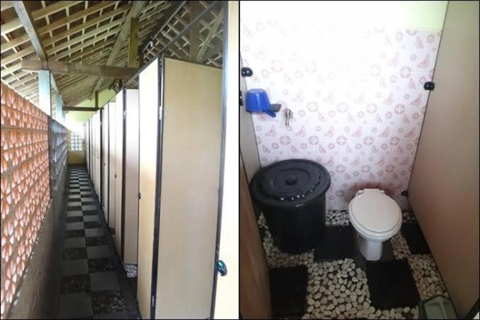武吉丁宜Exorcism Camp的两幅带卫生间和走廊的浴室图