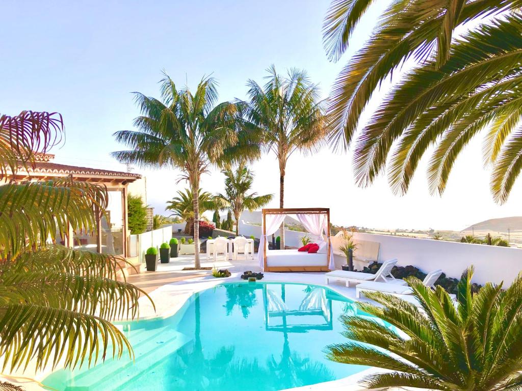洛斯·亚诺斯·德·阿里丹Villa Tajuya的别墅 - 带游泳池和棕榈树