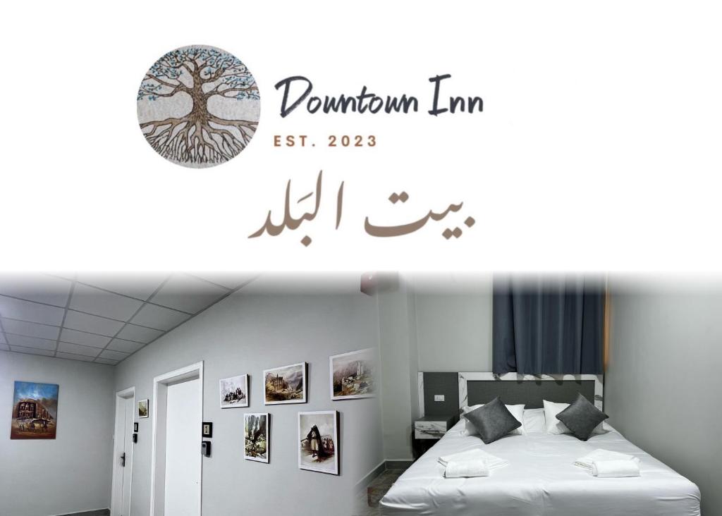 马达巴Downtown Inn Madaba的卧室配有一张挂有树标记的床铺,墙上挂有树标记