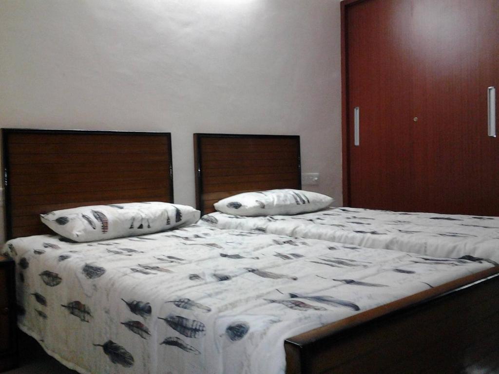 Vrindavan Guest House客房内的一张或多张床位