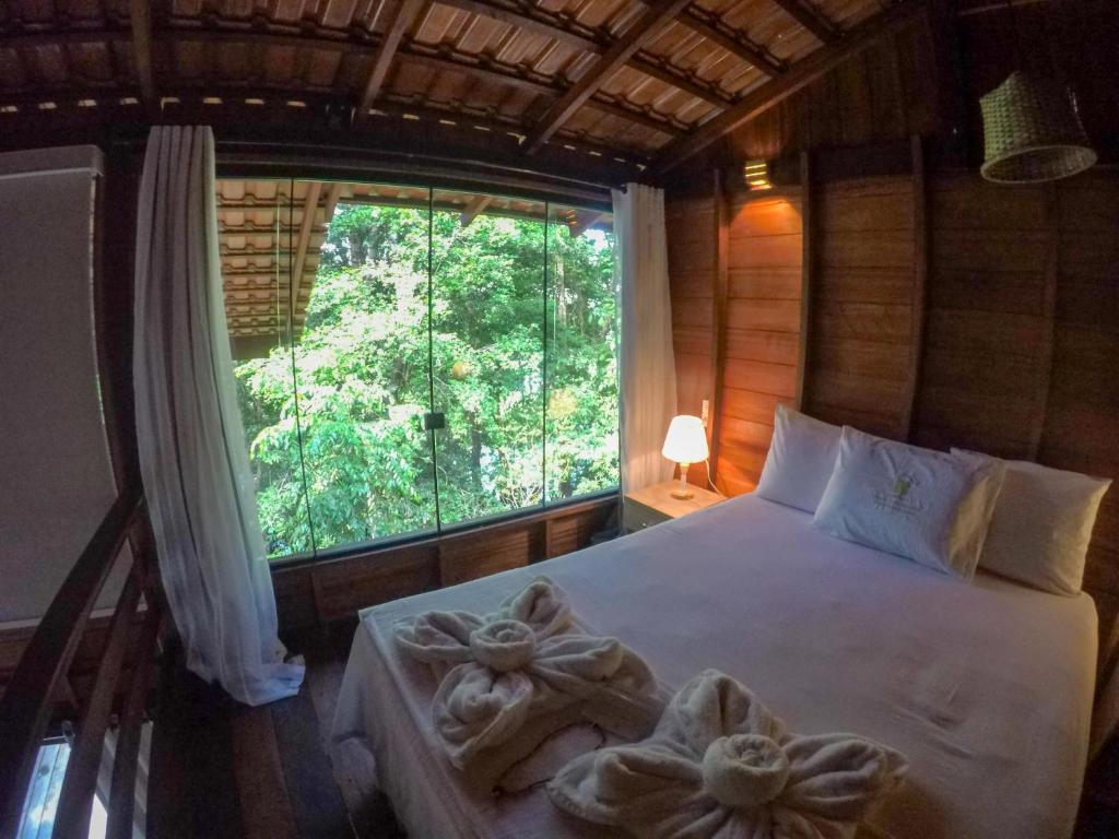 Amazon Premium Lodge客房内的一张或多张床位