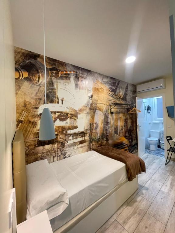 马德里奥利弗旅馆的墙上壁画的房间里一张床位