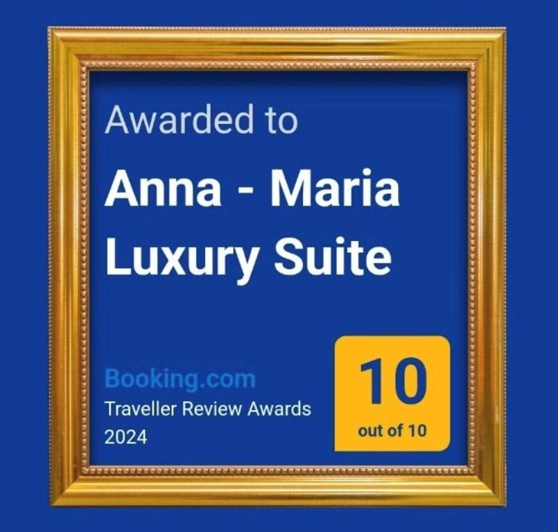 斯卡拉拉乔伊Anna - Maria Luxury Suite的一张照片框架,上面的文字被授予了AMMA豪华套房