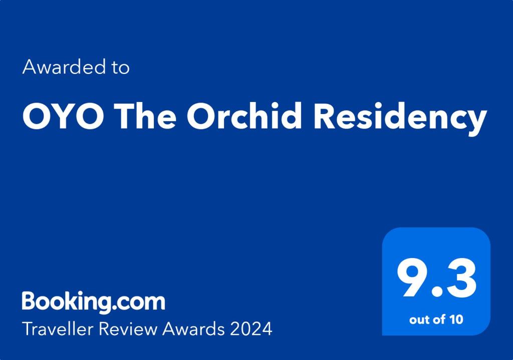 加尔各答Super OYO The Orchid Residency的兰花居住地的蓝色标志