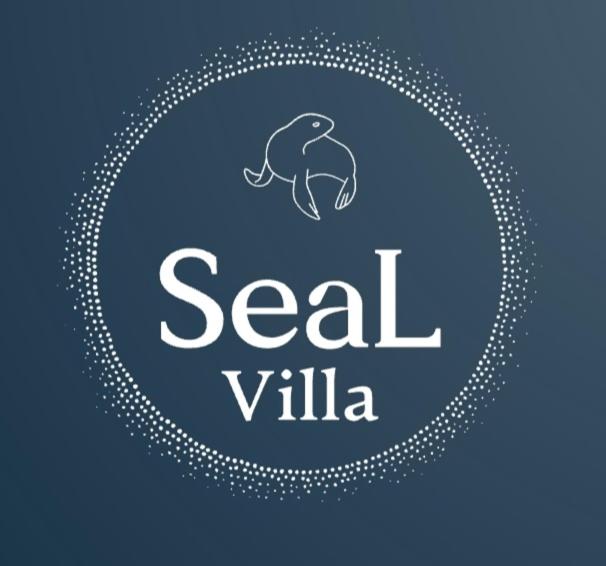 阿洛尼索斯古镇SeaL Villa的圆圈里大象的海鲜餐厅的标志