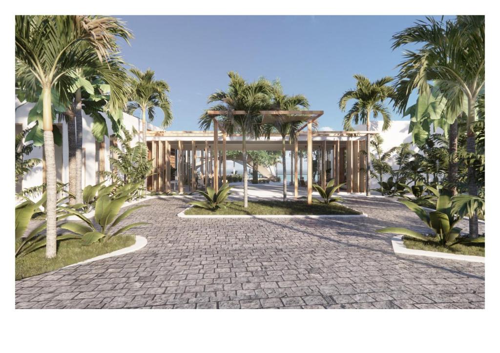 BambooSilversands Beach House Grenada的棕榈树庭院和建筑的 ⁇ 染