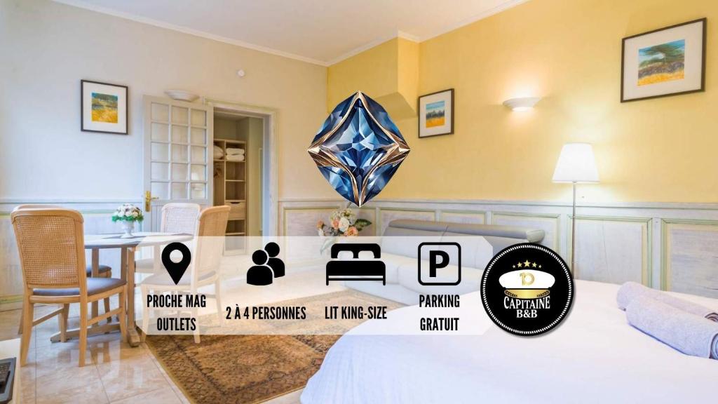 圣玛丽桥Le SAPHIR - Confort - Proche Mag Outlet Troyes - Parking gratuit的一间客房内配有床和桌子的房间