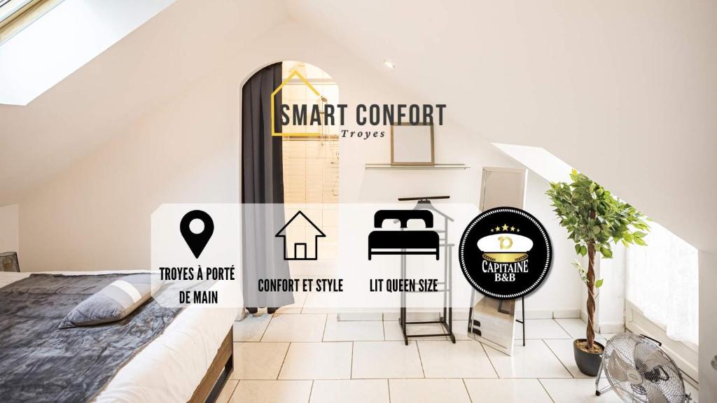 特鲁瓦Smart Confort 5 - Appartement confort et stylé的卧室墙上有智能合同标志