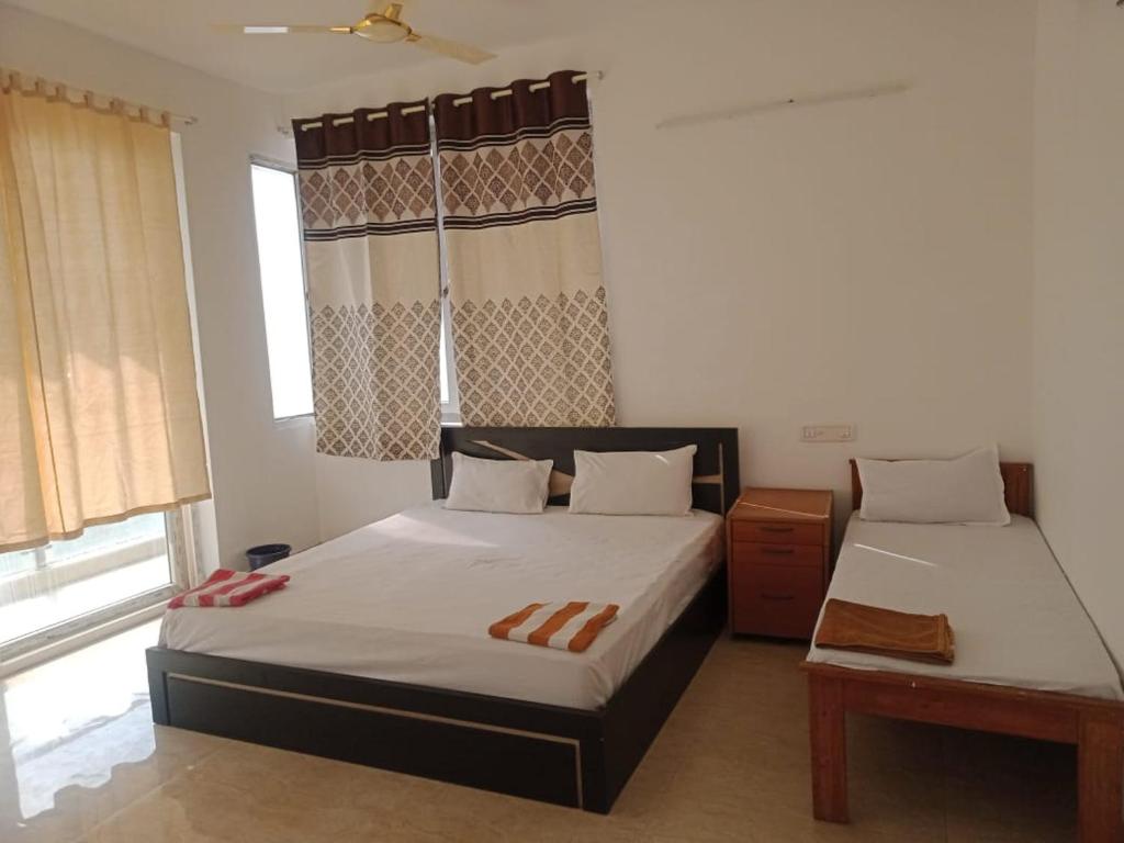 Suman beach House客房内的一张或多张床位
