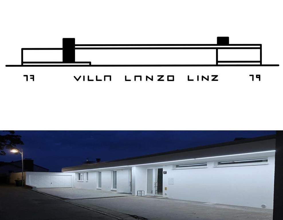 林茨VILLA LANZO Linz的白色的建筑,设有两扇白色的车库门