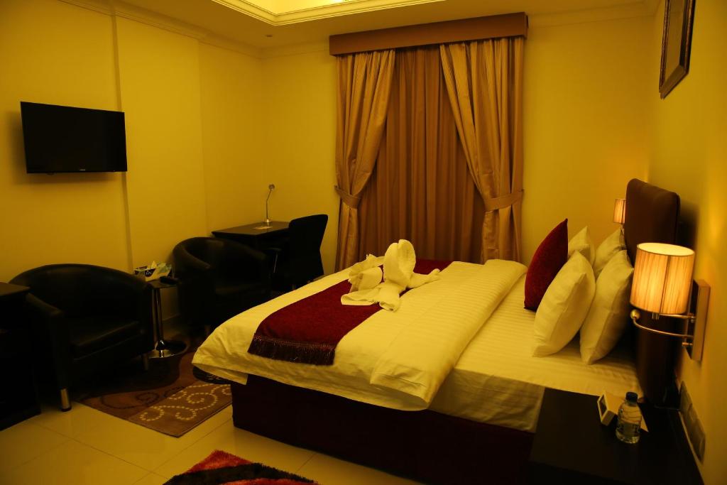 艾阿卡美丽华酒店客房内的一张或多张床位