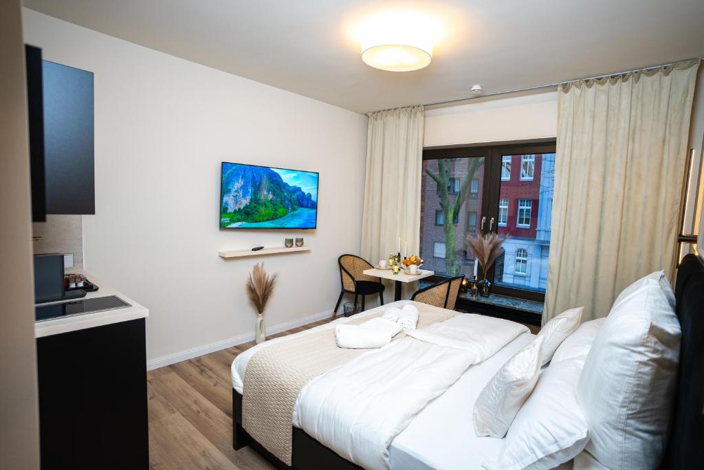 奥伯豪森Julys Apartment Nr 3的酒店客房设有床和窗户。