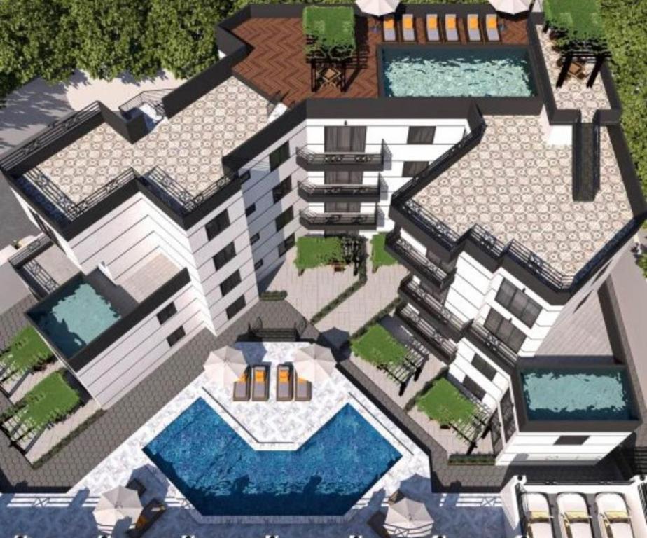沙姆沙伊赫Montazah seaside homes的享有带游泳池的建筑景致