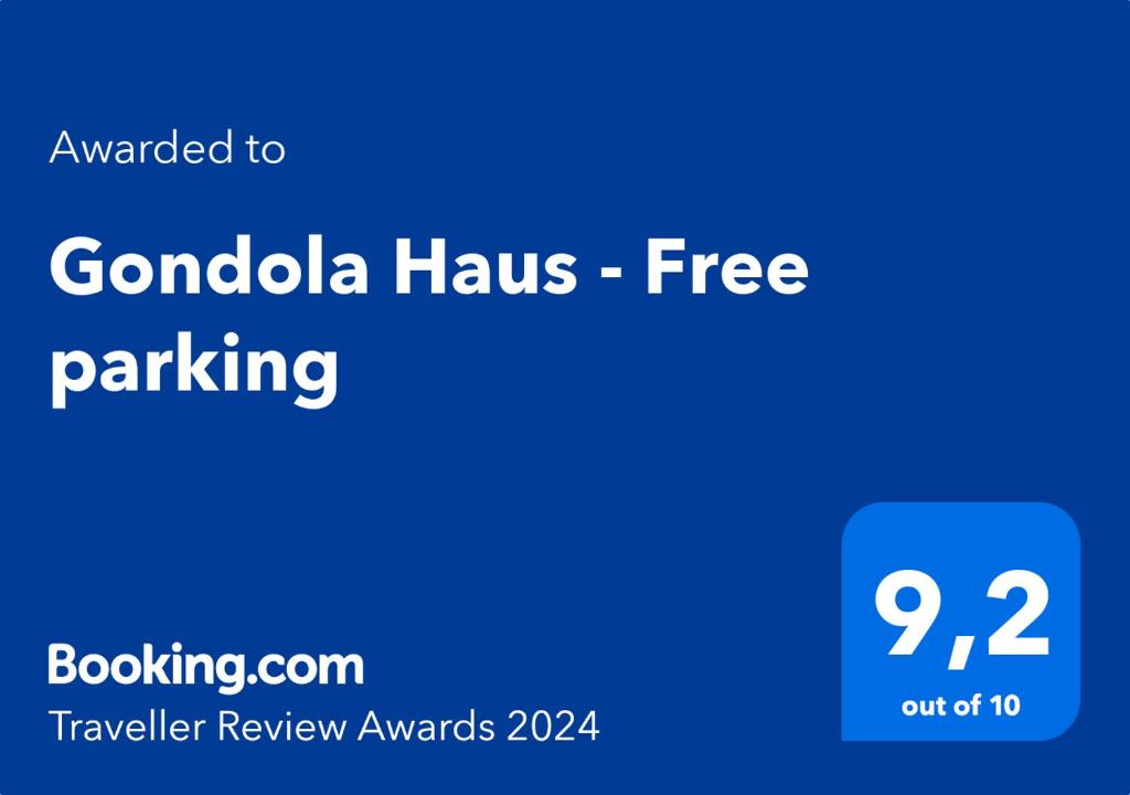 惠斯勒Gondola Haus - Free parking的蓝色标志,上面写着贡萨洛的字眼,免费停车场