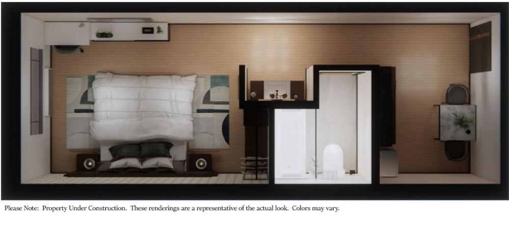 普兰菲尔德eStudio Suites的一张卧室的照片,里面放一张床
