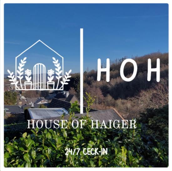 海格尔House of Haiger Ferienwohnung mit Charme的竖琴家的竖琴家的标志