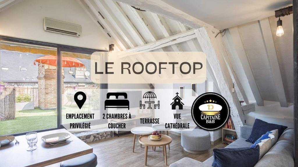 特鲁瓦Le Rooftop - vue Cathédrale - Climatisation的客厅,上面有阅读屋顶的标志