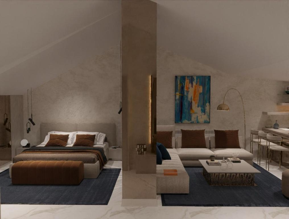伊斯坦布尔The Capri Hotel Osmanbey的客厅配有床和沙发