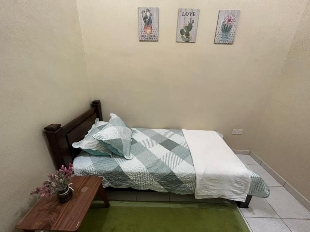 HomestayMuslim Safiyya客房内的一张或多张床位