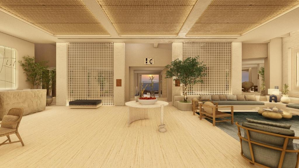 GrikosPatmos Aktis Resort & Spa的客厅配有沙发和桌子