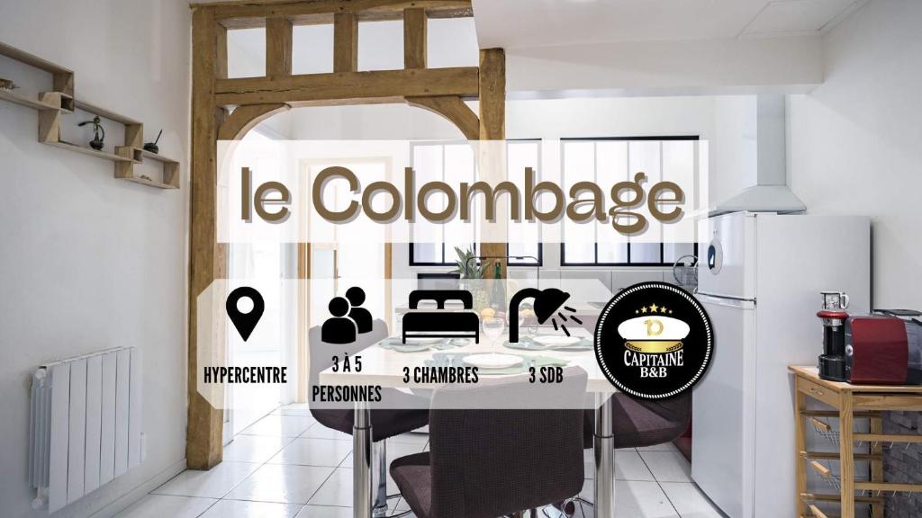 特鲁瓦Le Colombage-3 chambres- Hypercentre的厨房里设有一张桌子,上面标着橙色的标语