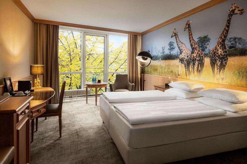 Amedia Hotel &amp; Suites Leipzig, Trademark Collection by Wyndham客房内的一张或多张床位