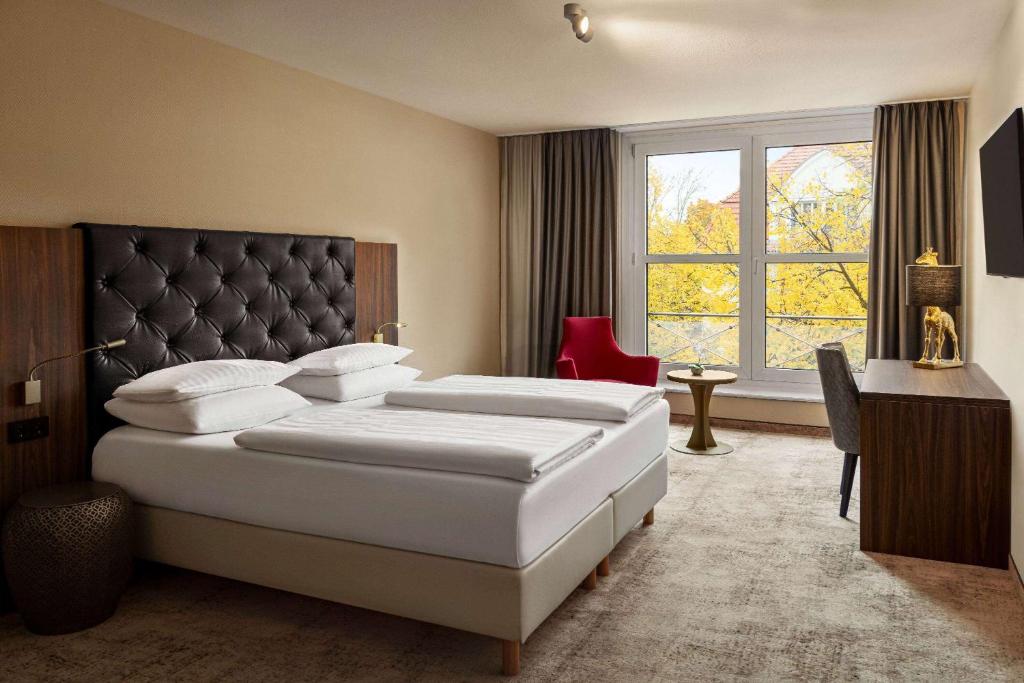 Amedia Hotel &amp; Suites Leipzig, Trademark Collection by Wyndham客房内的一张或多张床位