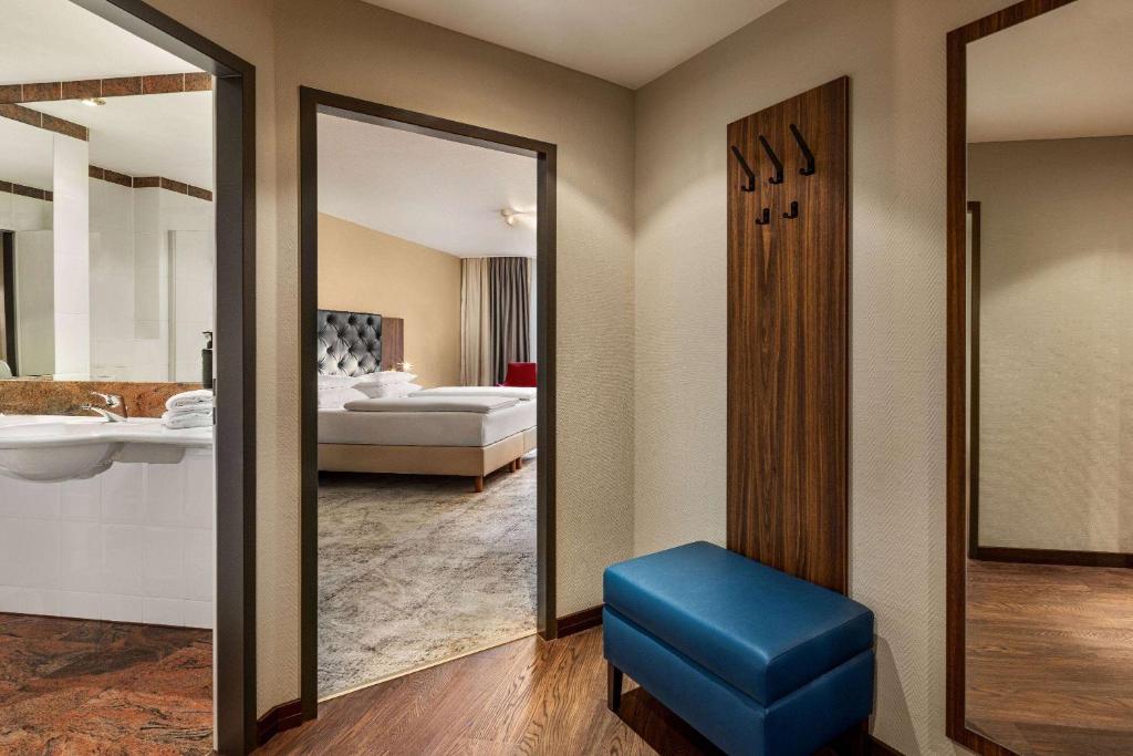 Amedia Hotel &amp; Suites Leipzig, Trademark Collection by Wyndham客房内的一张或多张床位