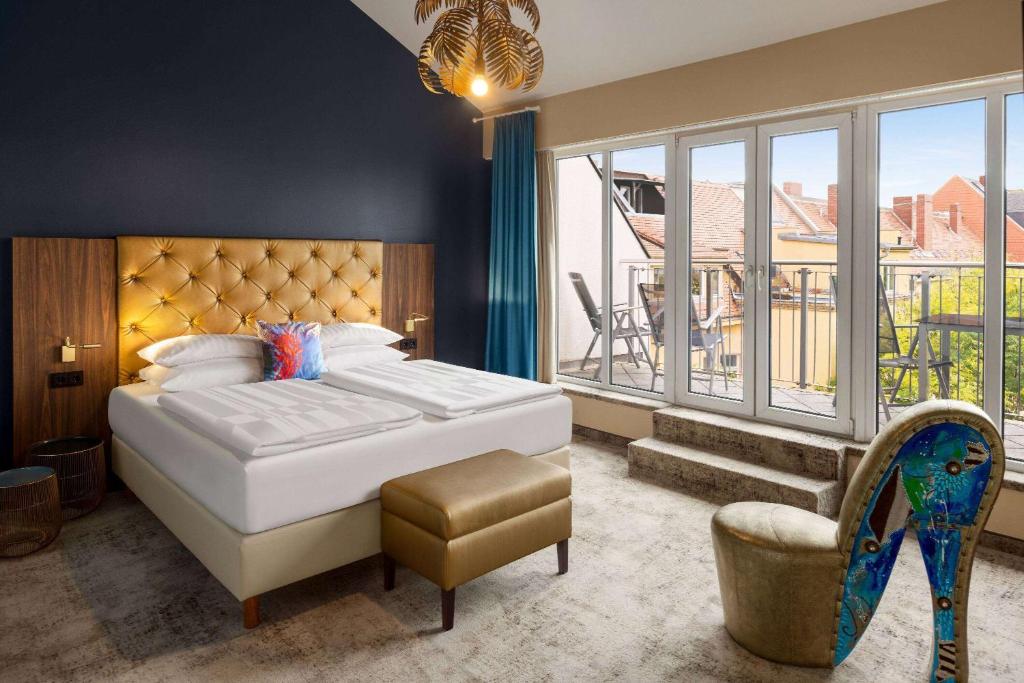 Amedia Hotel &amp; Suites Leipzig, Trademark Collection by Wyndham客房内的一张或多张床位