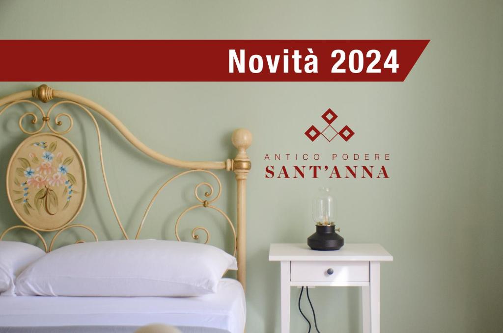 GelloAntico Podere Sant'Anna的阅读诺伊达的标牌,带有床和边桌