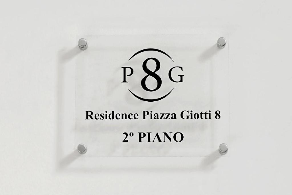 的里雅斯特Residence Piazza Giotti 8的一间耐文本的餐厅的标志