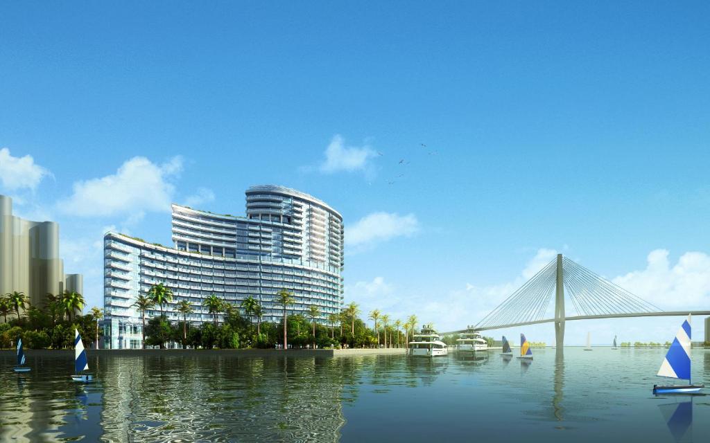 海口海口华彩洲际酒店的水中一座桥的建筑的 ⁇ 染