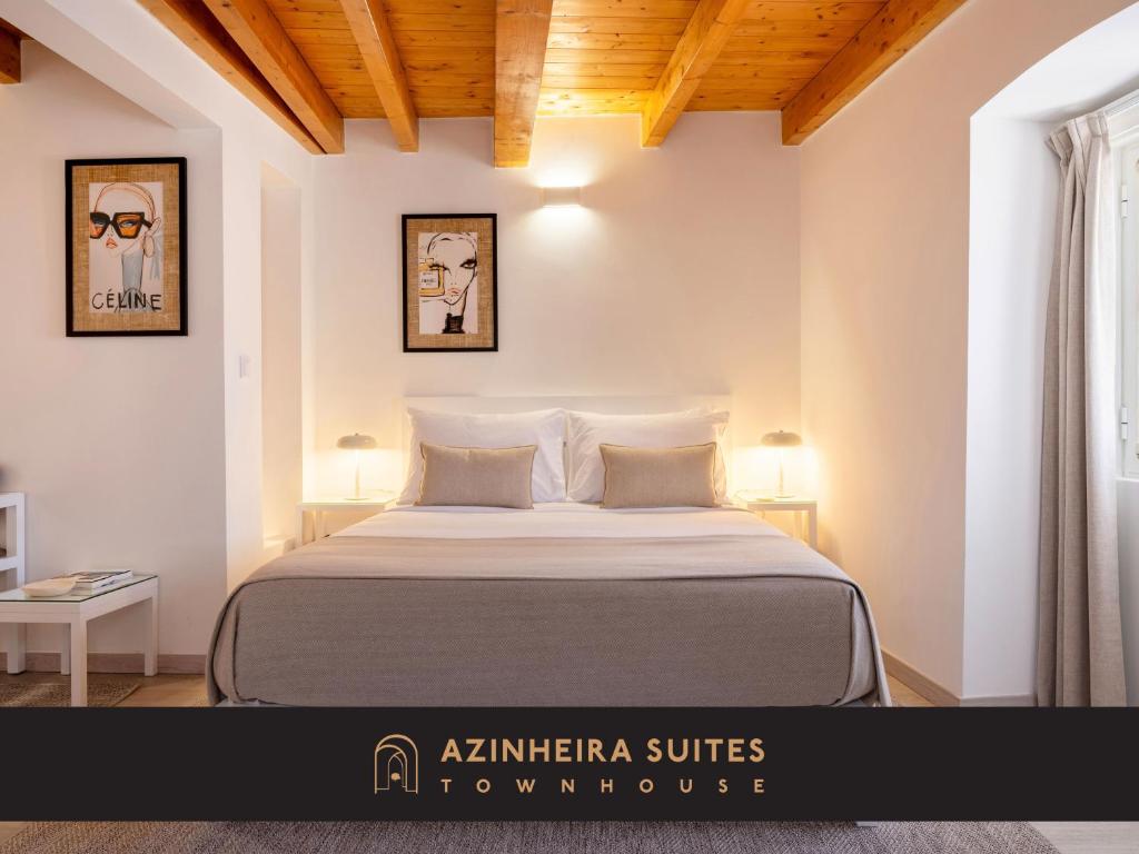 埃尔瓦斯Azinheira Suites Townhouse - Alojamento Turístico的一间卧室,卧室内配有一张大床