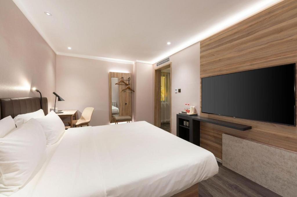 Hanting Premium Hotel Dalian Airport客房内的一张或多张床位