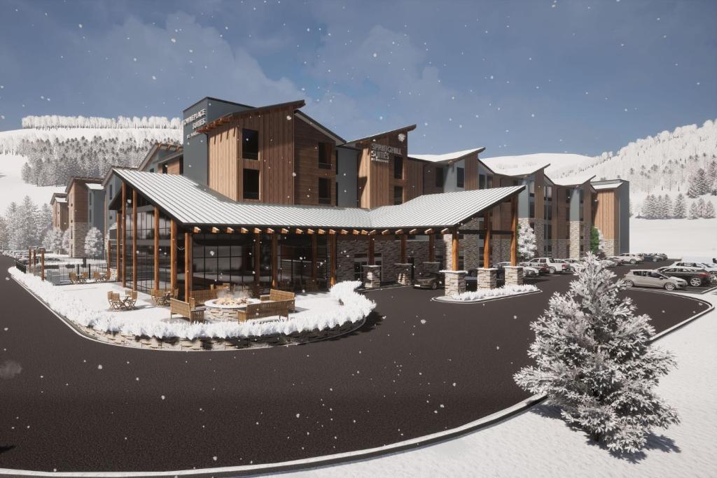 埃文SpringHill Suites by Marriott Avon Vail Valley的雪中小屋的 ⁇ 染