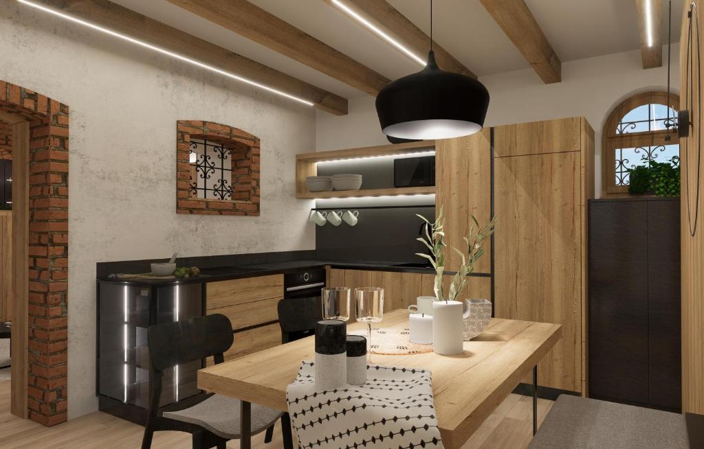 梅德沃代Suita beli Labod的一间带木桌的厨房和一间餐厅