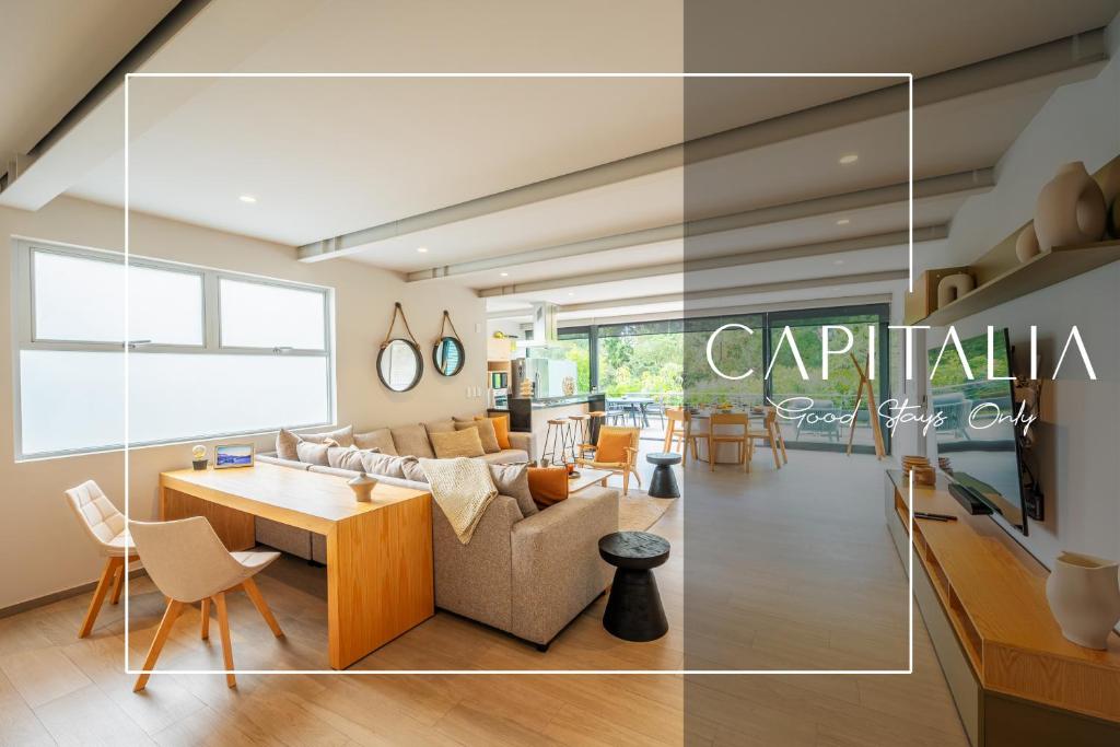 墨西哥城Capitalia - Luxury Apartments - Polanco - Alejandro Dumas的客厅配有沙发和桌子