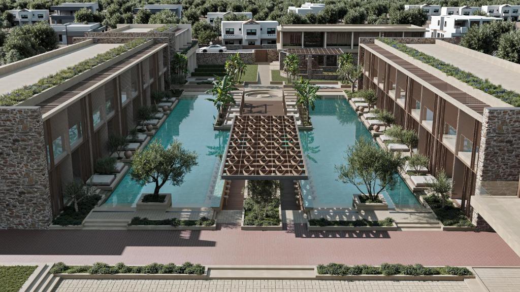 希俄斯PEARL ISLAND CHIOS HOTEL & SPA的享有带游泳池的建筑的空中景致