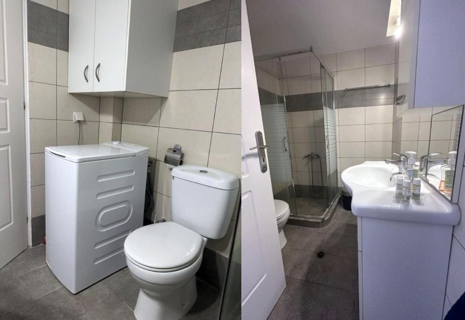 Agia ParaskeviIFESTIA HOUSE的白色的浴室设有卫生间和水槽。