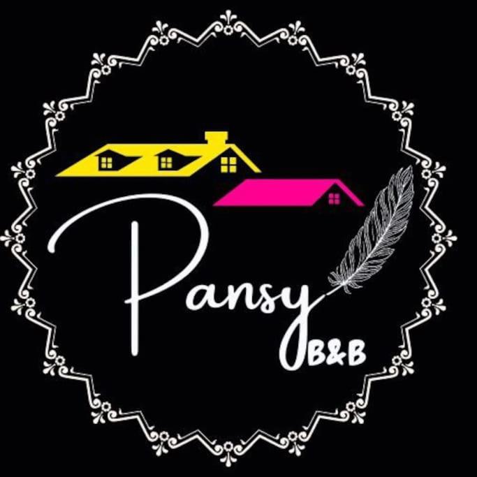 古瓦哈提Pansy B&B的房屋和羽毛的家庭契约标志
