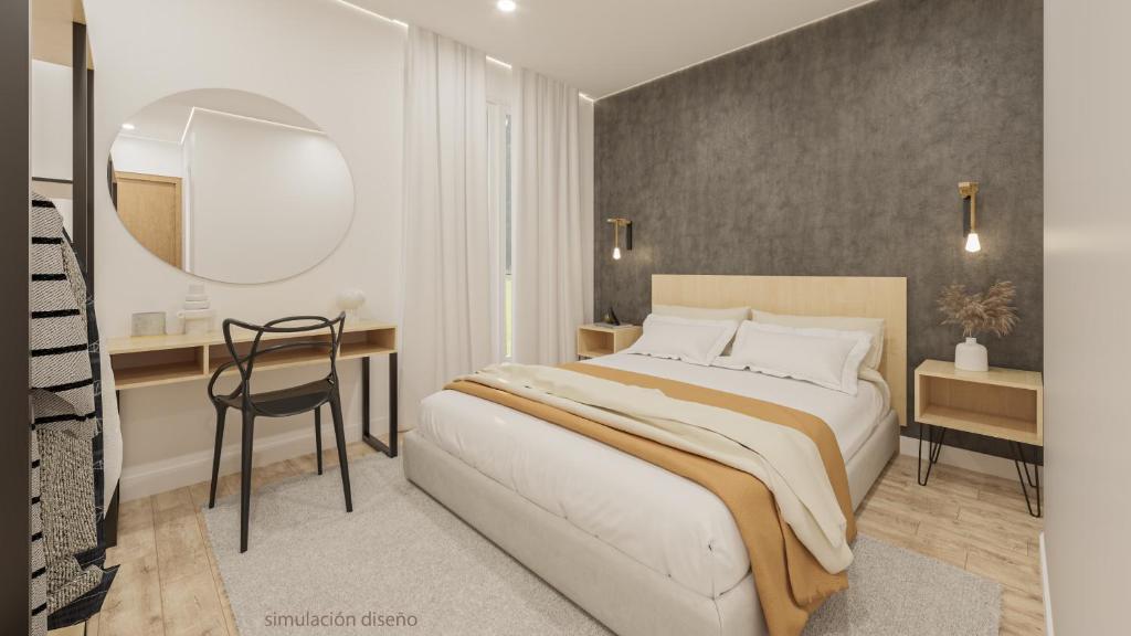 毕尔巴鄂Casual Fuentes的一间卧室配有一张床、一张桌子和一面镜子