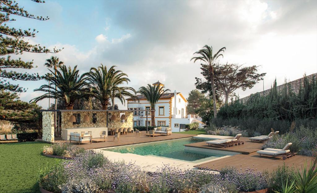 费雷列斯Hotel Rural Sant Patrici的一座带游泳池和棕榈树的房子