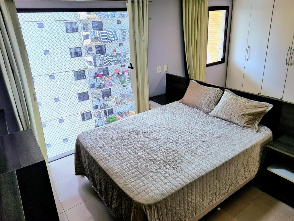Royal Duplex Umarizal客房内的一张或多张床位