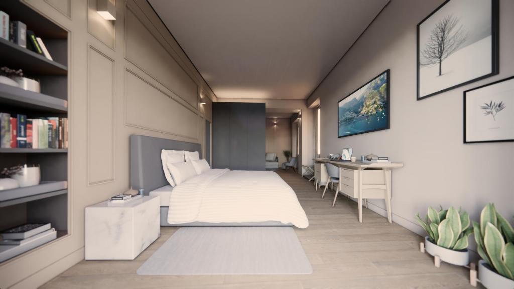 贝拉吉奥Hotel Du Lac & SPA的卧室配有白色的床和书桌