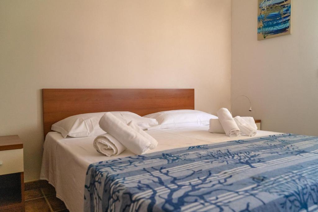 阿瓜公寓酒店客房内的一张或多张床位
