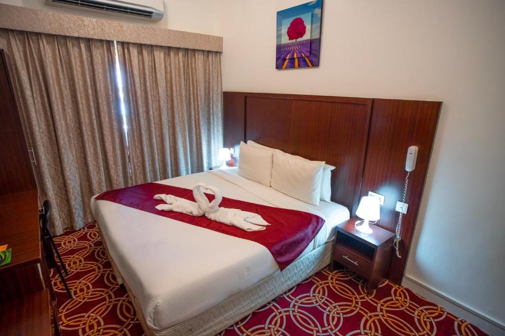 AL KARNAK HOTEL - BRANCH客房内的一张或多张床位