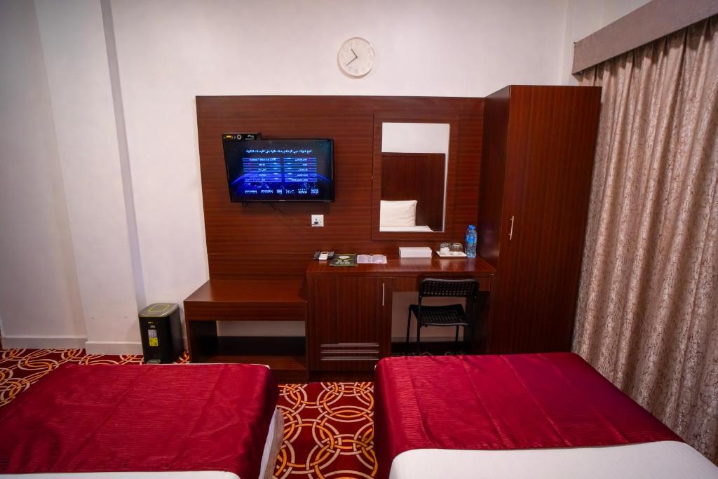 AL KARNAK HOTEL - BRANCH客房内的一张或多张床位