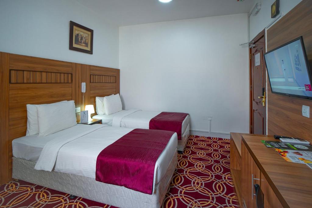 AL KARNAK HOTEL - BRANCH客房内的一张或多张床位